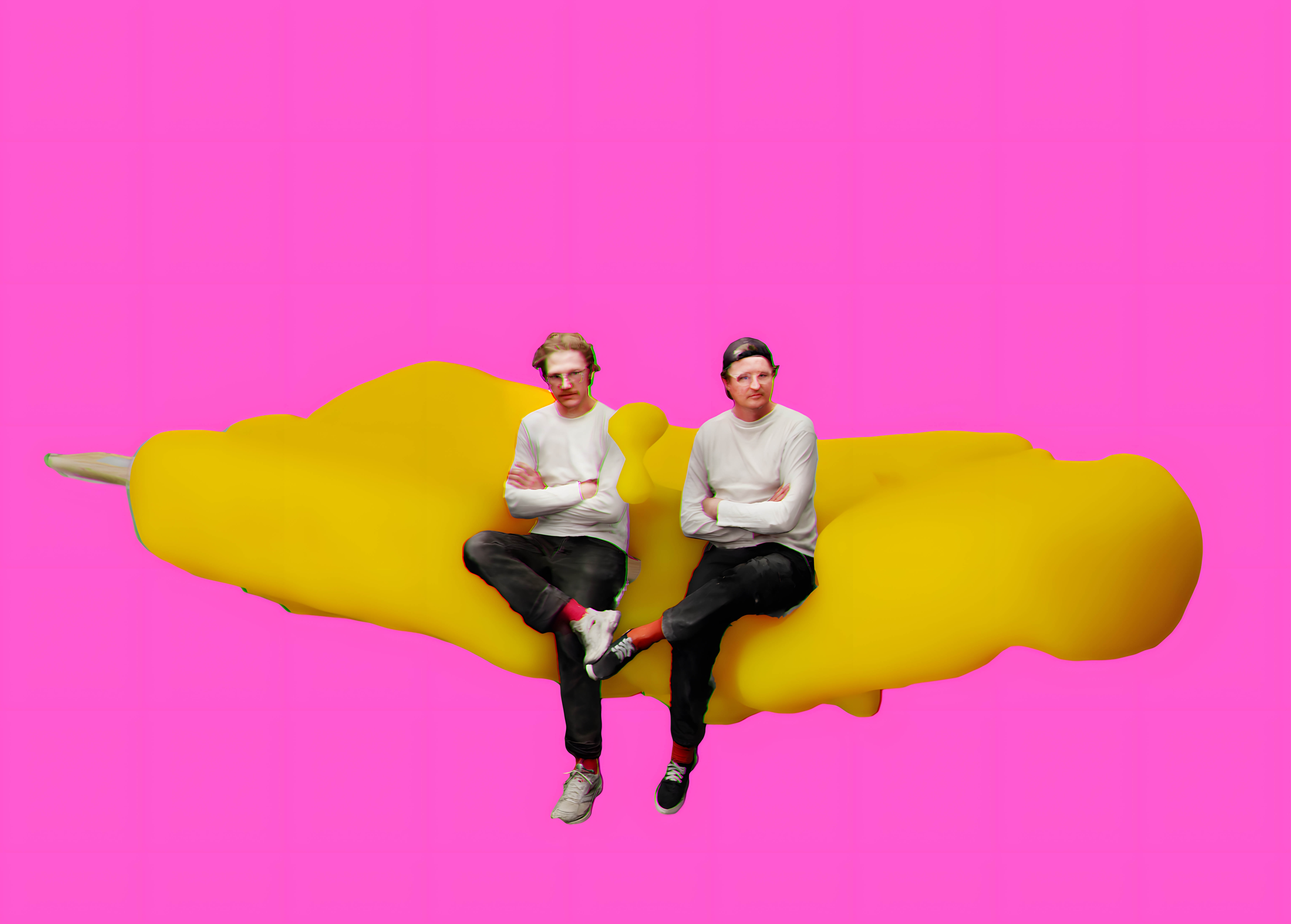 The artists Jan Neukirchen and Christian Lohre sit on a yellow exhibition object - in a digital work of art.