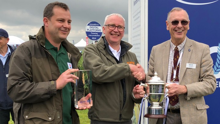Mark-Dodds-and-Andrew-Newby-receive-the-NIAB-Cereals-Cup-from-NIAB-director-Jim-Godfrey.jpeg