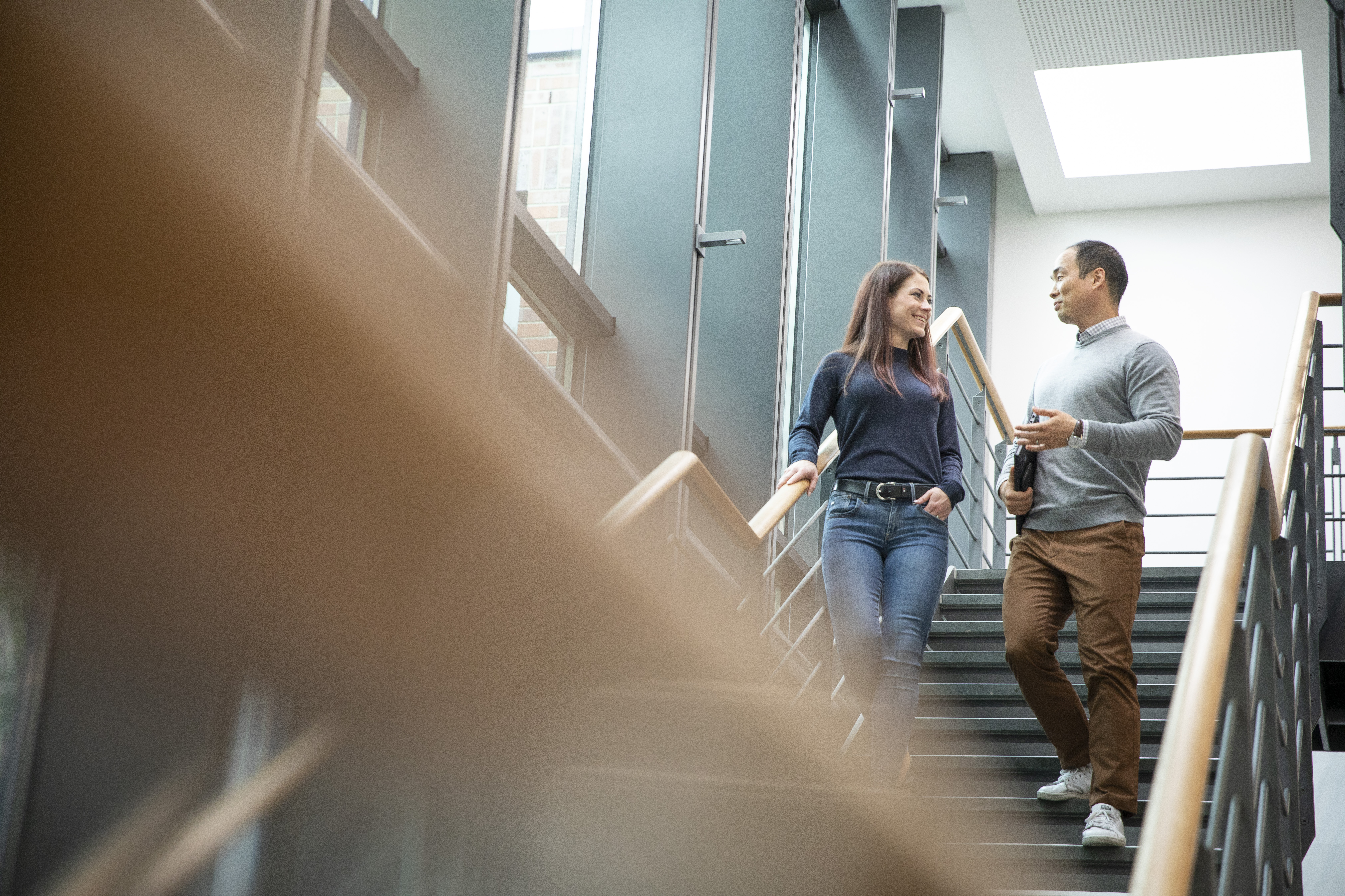 KWS-two-people-walking-down-stairs.jpg