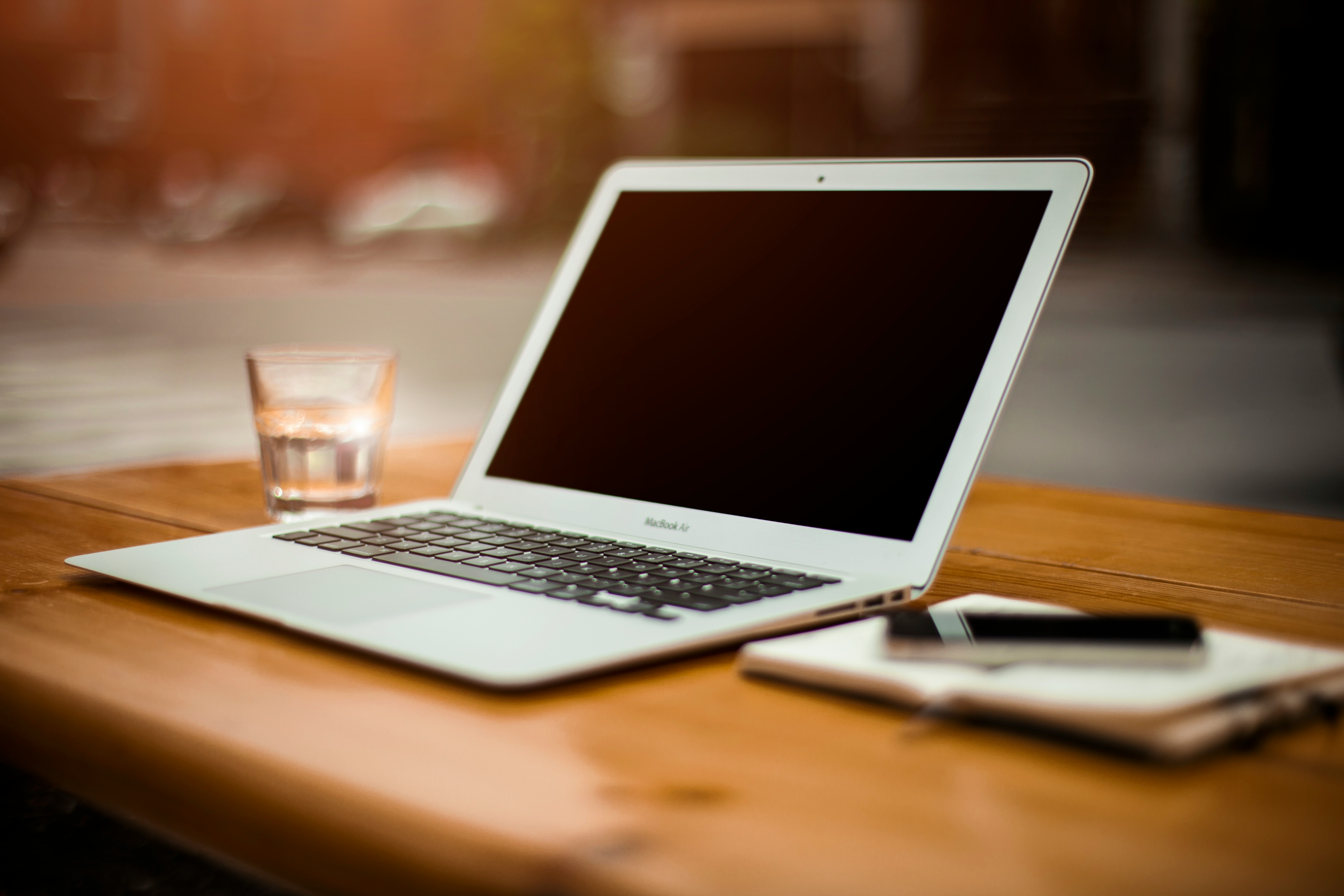 An open notebook on a wooden desk