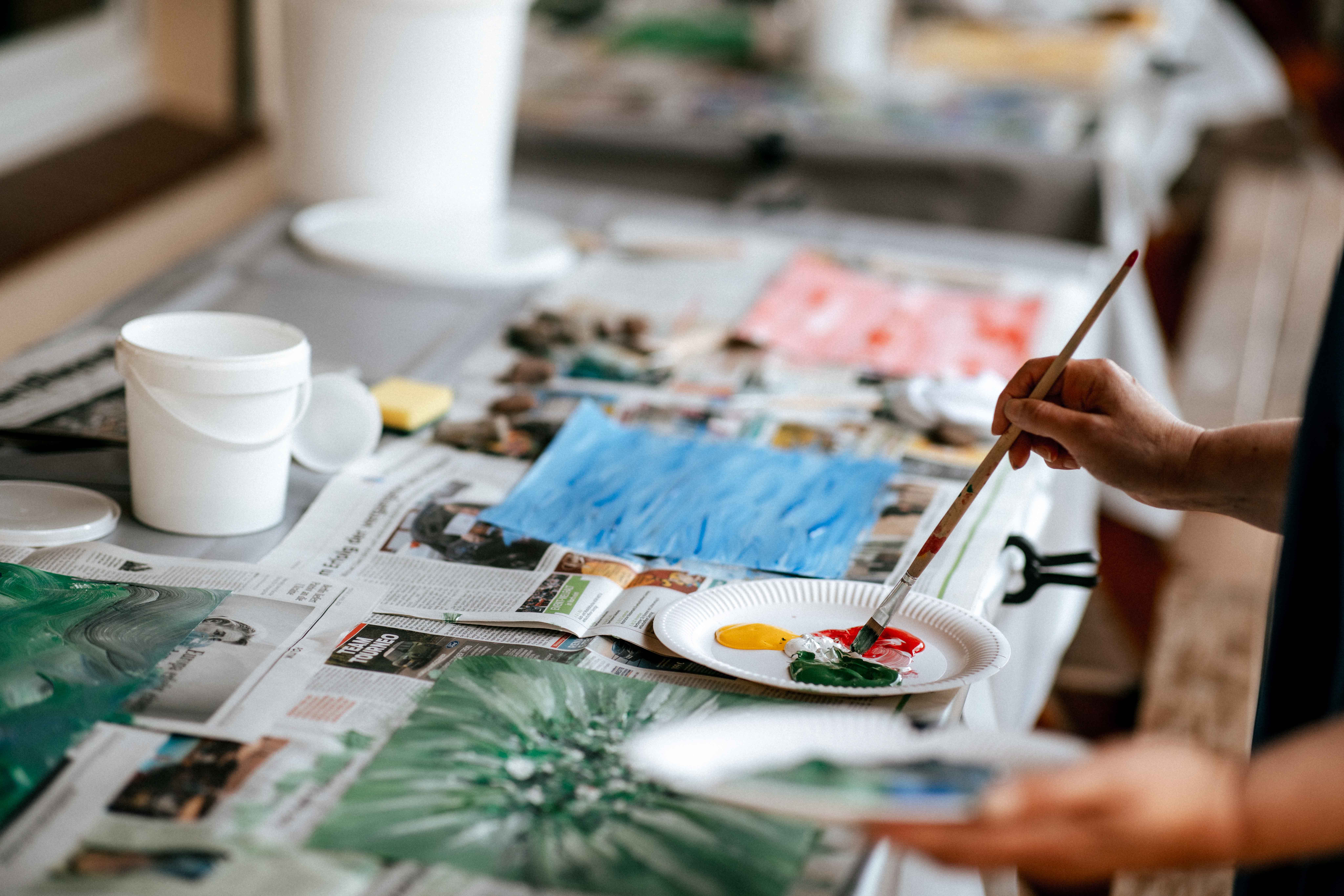 Process of making - colors are mixed and applied to the sheet which lies on newsprint
