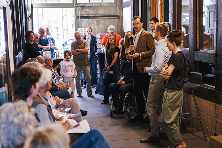 The audience listening to the opening speech